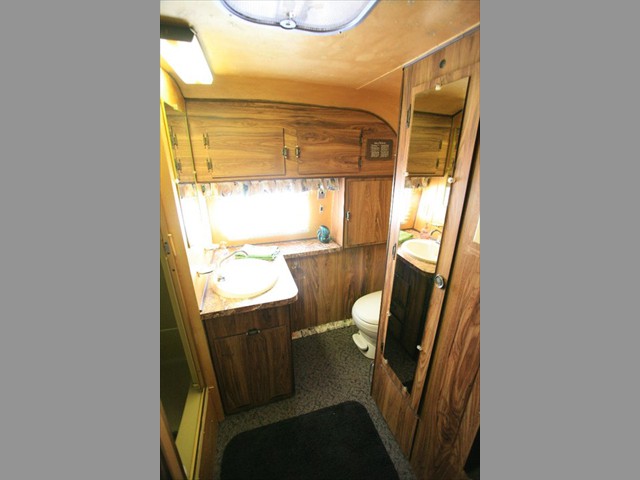And a large full bath with 70's style paneling.
